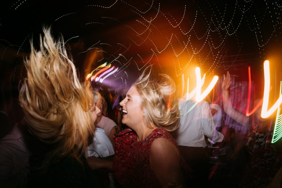 Fun Devon wedding party dancing. Guests enjoying the wedding reception.